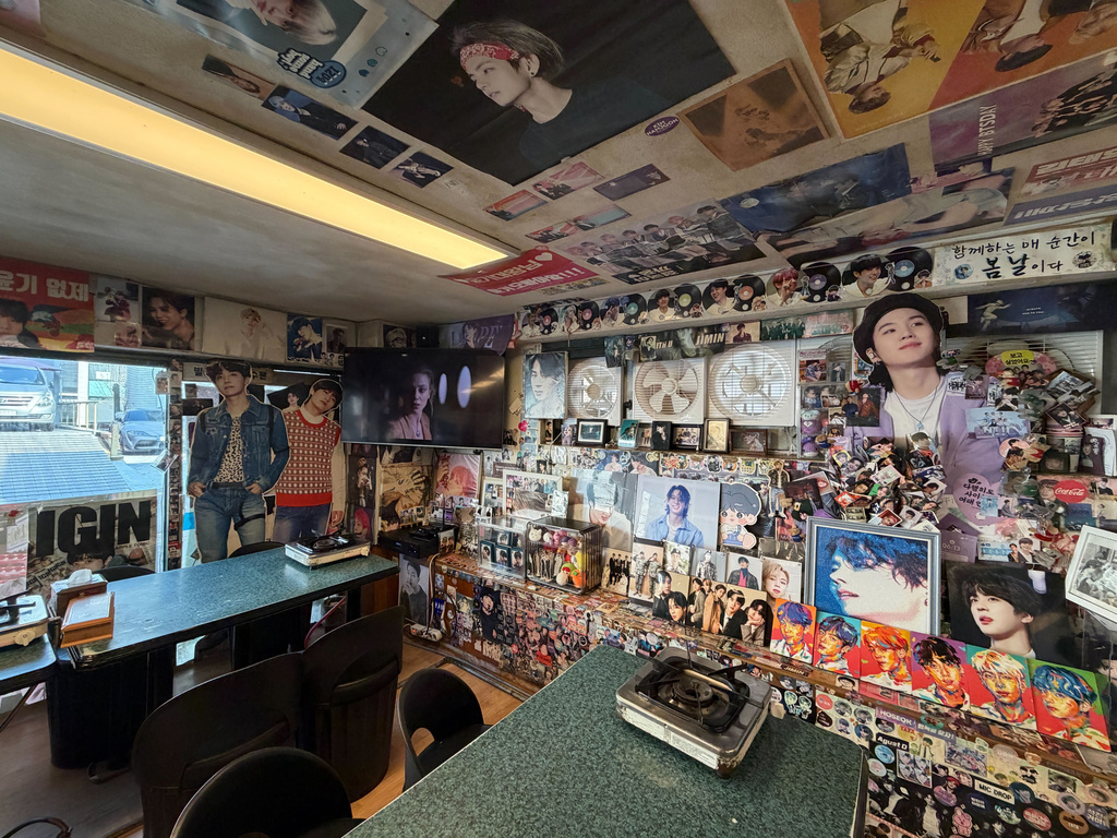 Walls are decorated by pictures of K-pop band BTS at Yoojung Sikdang, a restaurant in Seoul where BTS members frequently ate during their trainee days, in Seoul, South Korea, Friday, March 20, 2026. (AP Photo/Juwon Park)