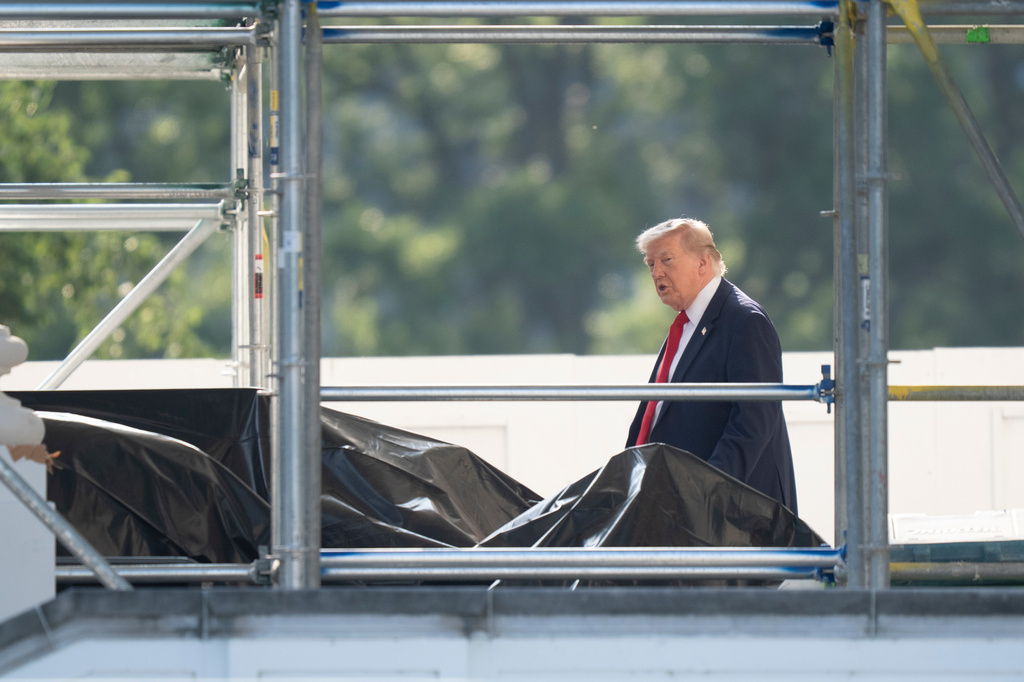 President Donald Trump walks through scaffolding on the North Portico as he leaves the White House to travel to Medora, N.D. for the opening of the Theodore Roosevelt Presidential Library, Wednesday, July 1, 2026, in Washington. (AP Photo/Manuel Balce Ceneta)