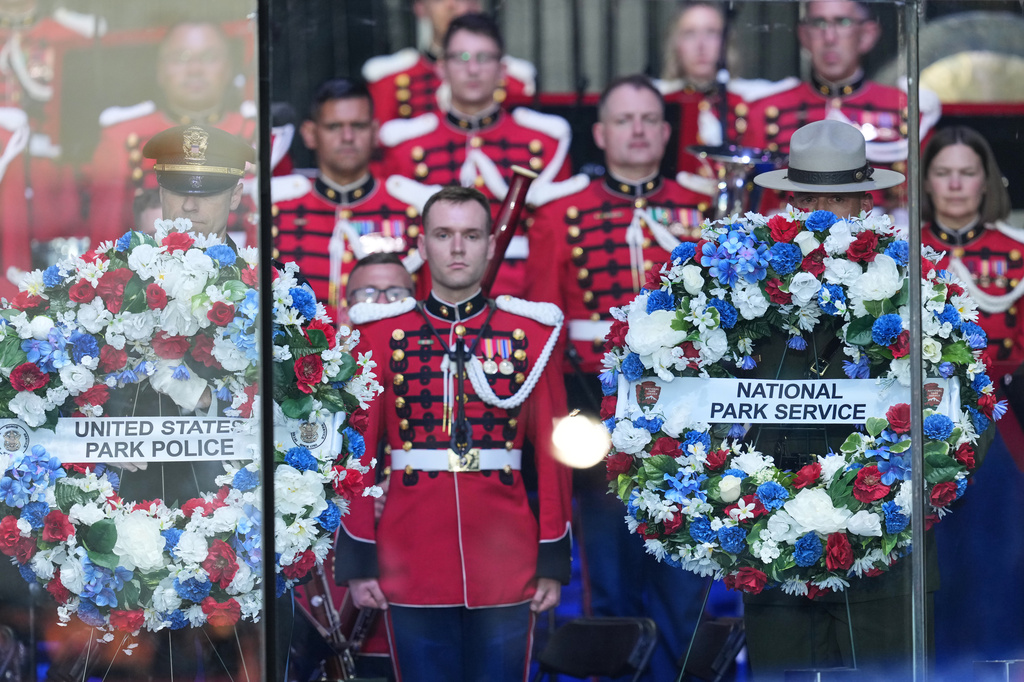 Wreaths honoring U.S. Park Police and the National Park Service are laid before President Donald Trump speaks at the opening of the Great American State Fair on the National Mall, Wednesday, June 24, 2026, in Washington. (AP Photo/Alex Brandon)