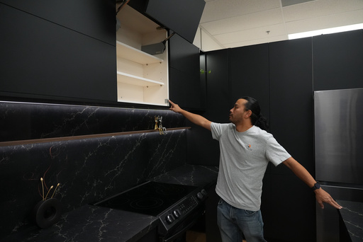 Josh Qian, co-founder of Linq Kitchen, a designer and maker of kitchen cabinets, shows his company's show room and warehouse in City of Industry, Calif., Friday, Oct. 10, 2025. (AP Photo/Damian Dovarganes) Josh Qian, co-founder of Linq Kitchen, a designer and maker of kitchen cabinets, shows his company's show room and warehouse in City of Industry, Calif., Friday, Oct. 10, 2025. (AP Photo/Damian Dovarganes)