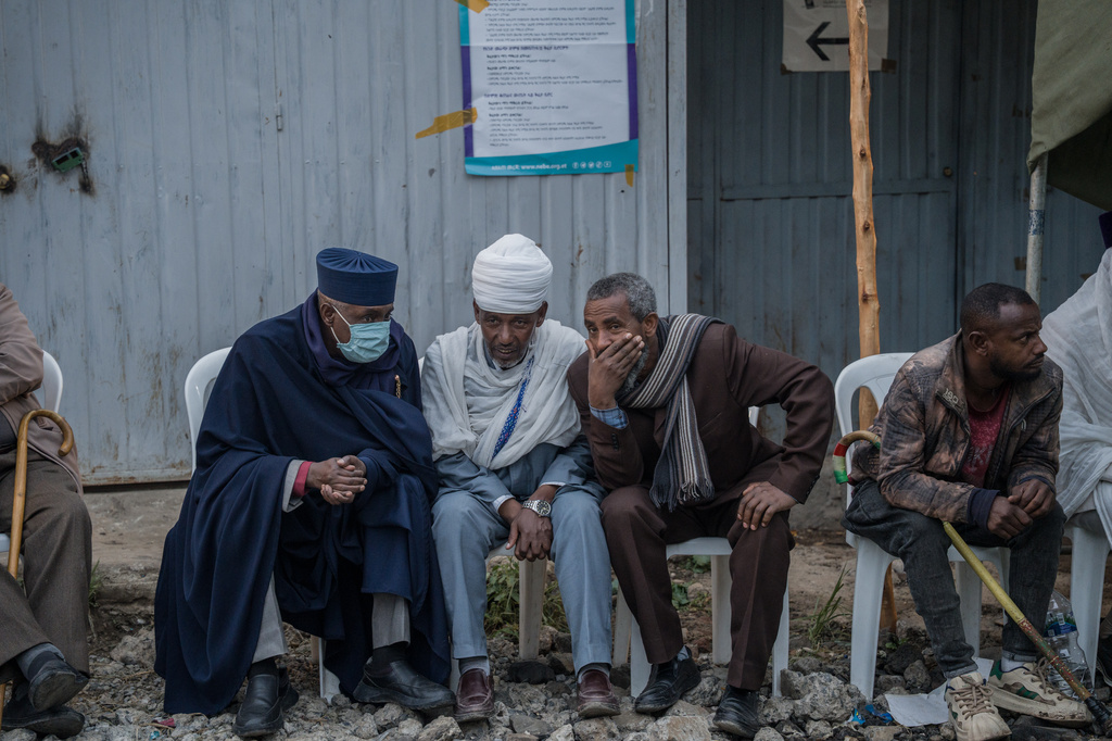 People gather outside a polling station before casting their votes in the general election in Addis Ababa, Ethiopia, Monday, June 1, 2026. (AP Photo/Amanuel Sileshi)