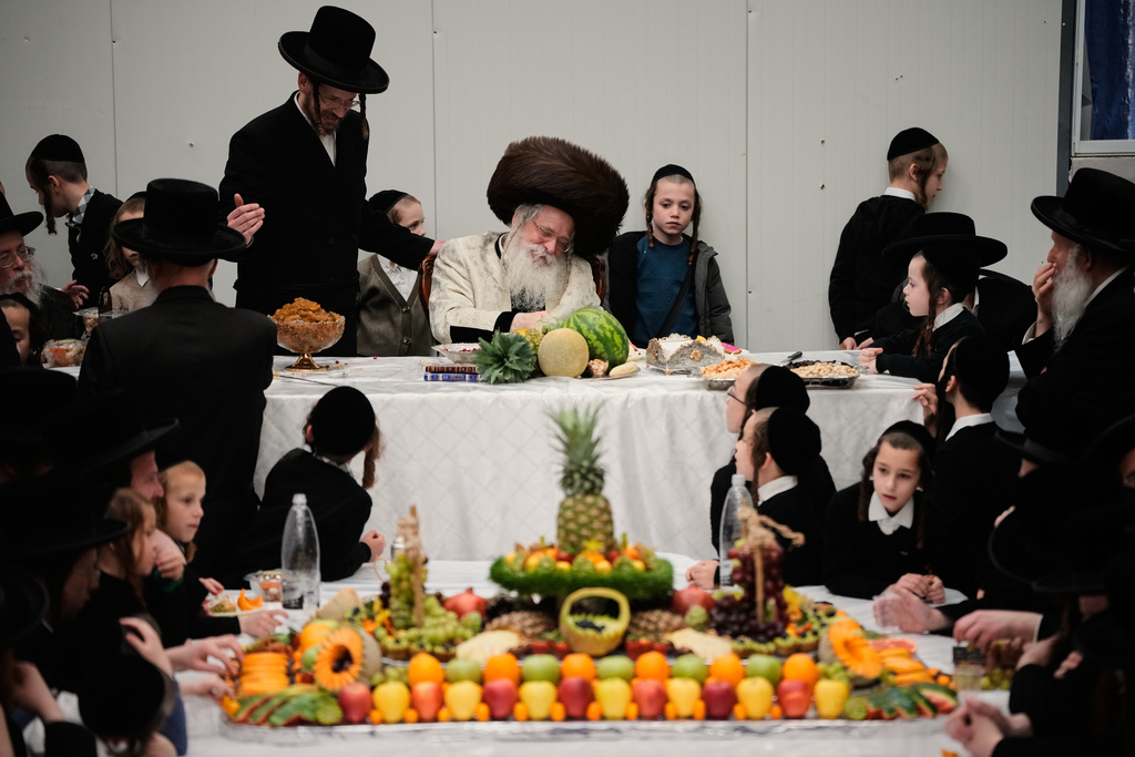 Ultra-Orthodox Jews from the Nadvorna Hasidic dynasty celebrate the Jewish holiday of Tu Bishvat, the "New Year of the Trees," in Jerusalem, Monday, Feb. 2, 2026. (AP Photo/Ohad Zwigenberg)