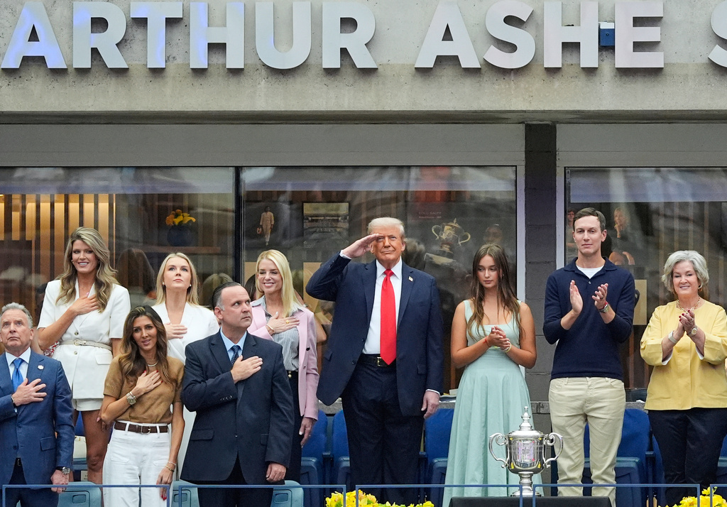 FILE - President Donald Trump, center, and others stand for the national anthem before the US Open tennis men's singles final, Sept. 7, 2025, in Flushing, N.Y. (AP Photo/Manuel Balce Ceneta, File)