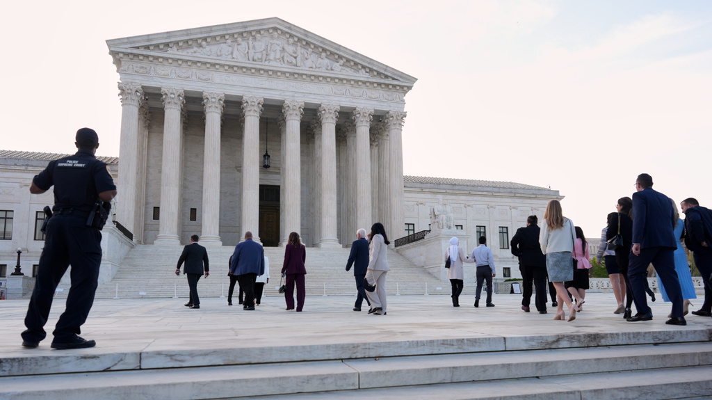 People arrive to walk inside the U.S. Supreme Court, on Capitol Hill in Washington, Wednesday, April 1, 2026. The Supreme Court justices will hear oral arguments today on whether President Donald Trump can deny citizenship to children born to parents who are in the United States illegally or temporarily. (AP Photo/J. Scott Applewhite)