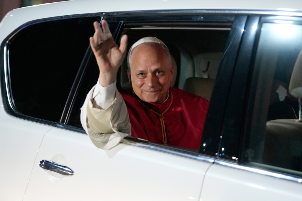 Pope Leo XIV waves to the crowd at the Parish of Our Lady of Fatima after meeting with bishops, priests, consecrated men and women, and pastoral workers in Luanda, Angola, Monday, April 20, 2026. (AP Photo/Themba Hadebe)