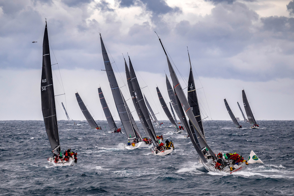 In this photo provided by the Cruising Yacht Club of Australia, competitors make a start in the Sydney Hobart yacht race in Sydney, Friday, Dec. 26, 2025. (Kurt Arrigo/CYCA via AP)