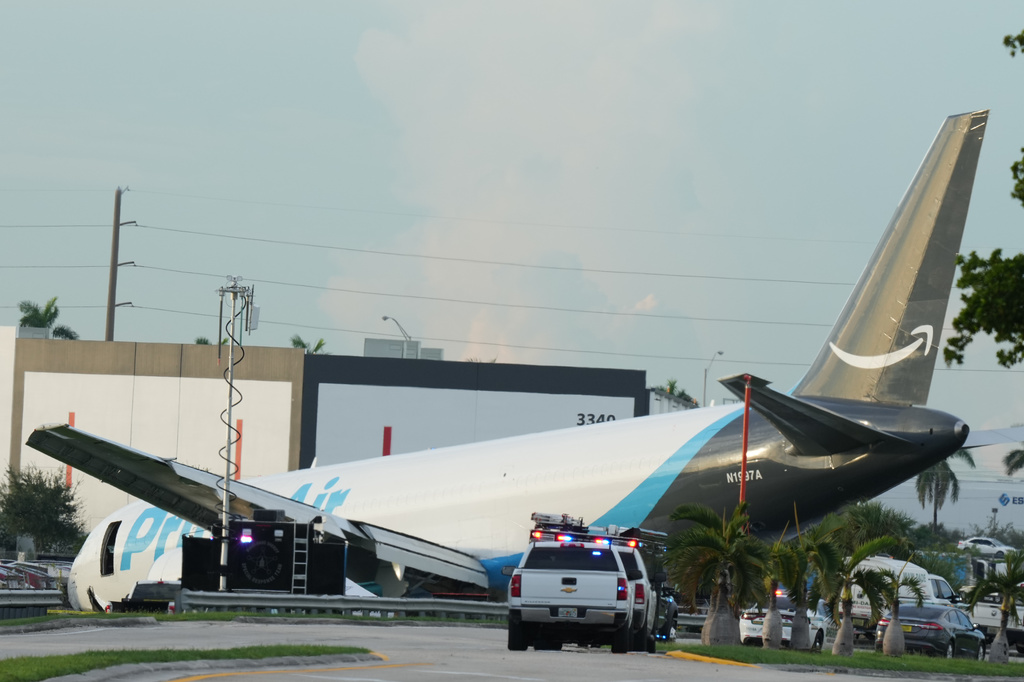 An Amazon cargo plane sits at the Miami International Airport (MIA) after it overshot the runway, Sunday, Sept. 6, 2026. (AP Photo/Lynne Sladky)