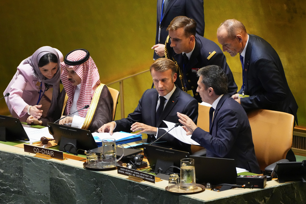 French President Emmanuel Macron, center, prepares to speak during a high-profile meeting at the United Nations aimed at galvanizing support for a two-state solution to the Israeli-Palestinian conflict Monday, Sept. 22, 2025, at UN headquarters. (AP Photo/Yuki Iwamura)