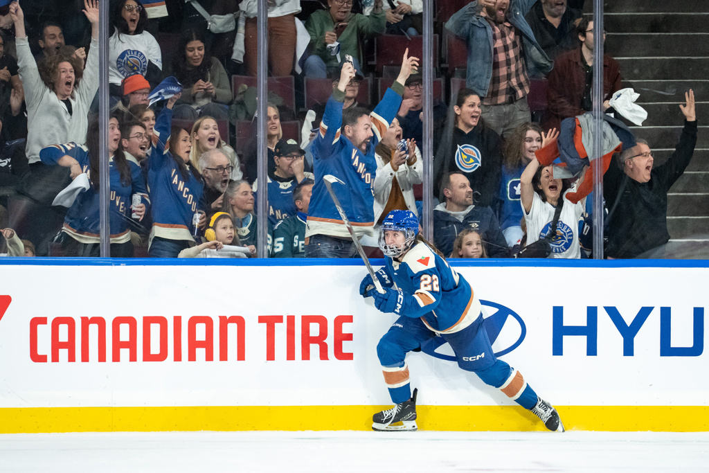 Vancouver Goldeneyes' Abby Boreen (22) celebrates her goal against the Seattle Torrent during overtime PWHL hockey action in Vancouver, on Friday, Nov. 21, 2025. (Ethan Cairns/The Canadian Press via AP)