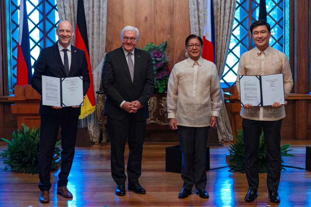 From left, Lufthansa Technik Philippines President Holger Beck, German President Frank-Walter Steinmeier, Philippine President Ferdinand Marcos Jr. and Bases Conversion and Development Authority (BCDA) President Joshua Bingcang pose for a picture with a signed agreement in Manila, Philippines Tuesday, June 16, 2026. (Ezra Acayan/Pool Photo via AP)