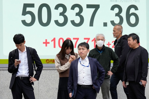 People stand in front of an electronic stock board showing Japan's Nikkei index at a securities firm Monday, Oct. 27, 2025, in Tokyo. (AP Photo/Eugene Hoshiko) People stand in front of an electronic stock board showing Japan's Nikkei index at a securities firm Monday, Oct. 27, 2025, in Tokyo. (AP Photo/Eugene Hoshiko)