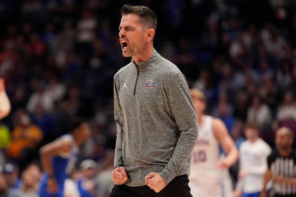 FILE - Florida head coach Todd Golden reacts to play against Kentucky during the second half of an NCAA college basketball game in the quarterfinal round of the Southeastern Conference tournament, March 13, 2026, in Nashville, Tenn. (AP Photo/George Walker IV, File)