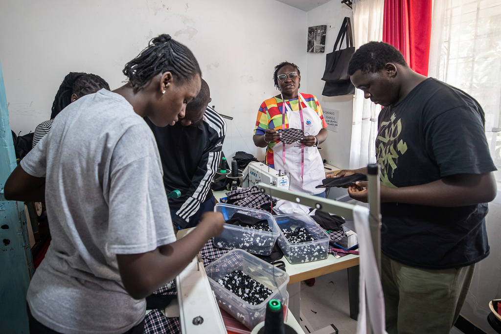 Volunteers sew reusable sanitary pads inside the Fempad NGO workshop in the Kibera informal settlement on the outskirts of Nairobi, Kenya, Feb. 12, 2026. (AP Photo/Atieno Muyuyi)