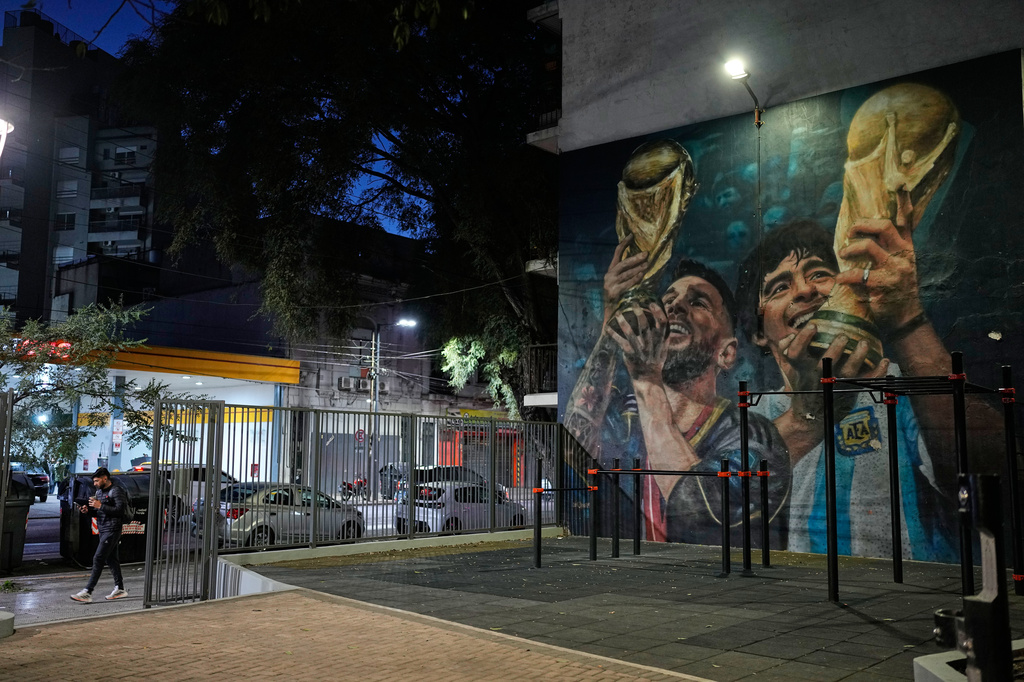 A mural of Argentine soccer players Lionel Messi and Diego Maradona decorate a wall in Buenos Aires, Argentina, early Thursday, July 30, 2026. (AP Photo/Natacha Pisarenko)