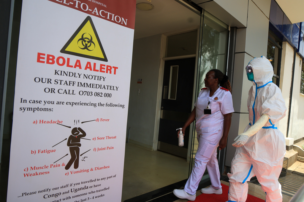 Health workers and officials walk outside a Ebola isolation facility at The Nairobi Hospital, Kenya, Wednesday, Oct. 7, 2026. (AP Photo/Andrew Kasuku)