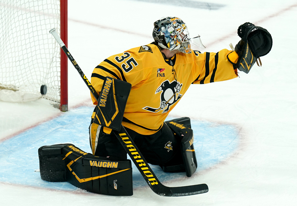A shot by Montréal Canadiens' Alexandre Texier gets by Pittsburgh Penguins goaltender Tristan Jarry (35) for a goal during the first period of an NHL hockey game, Thursday, Dec. 11, 2025, in Pittsburgh. (Matt Freed/Pittsburgh Post-Gazette via AP)