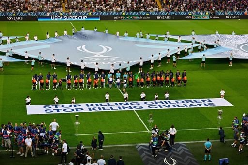 FILE - The players line up before the UEFA Super Cup soccer match between Paris Saint-Germain and Tottenham Hotspur in Udine, Italy, Wednesday, Aug. 13, 2025. (AP Photo/Denes Erdos, File) FILE - The players line up before the UEFA Super Cup soccer match between Paris Saint-Germain and Tottenham Hotspur in Udine, Italy, Wednesday, Aug. 13, 2025. (AP Photo/Denes Erdos, File)