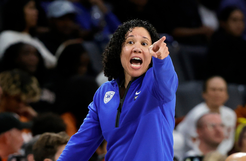 Duke head coach Kara Lawson calls out to players during the first half of an NCAA college basketball game between the South Carolina and the Duke in the Players Era tournament, Wednesday, Nov. 26, 2025, in Las Vegas. (AP Photo/Steve Marcus)