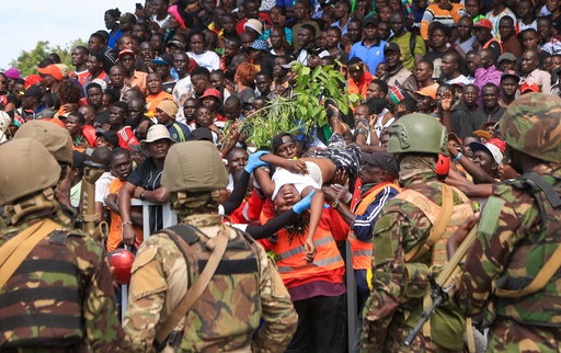 A woman is evacuated after fainting during the viewing of the body of former Kenya Prime Minister Raila Odinga at Jomo Kenyatta Stadium in Kisumu, Kenya, Saturday, Oct. 18, 2025. (AP Photo/Andrew Kasuku) A woman is evacuated after fainting during the viewing of the body of former Kenya Prime Minister Raila Odinga at Jomo Kenyatta Stadium in Kisumu, Kenya, Saturday, Oct. 18, 2025. (AP Photo/Andrew Kasuku)