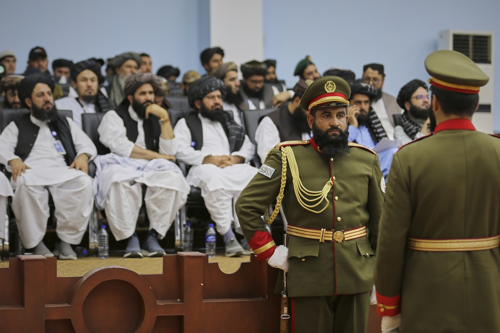 Soldiers affiliated to the Defence Ministry stand in guard during a meeting of delegates from across Afghanistan marking the start of celebrations of the fourth anniversary of the U.S. withdrawal and the start of Taliban rule, at Loya Jirga Hall in Kabul, Friday, Aug. 15, 2025. (AP Photo/Siddiqullah Alizai)