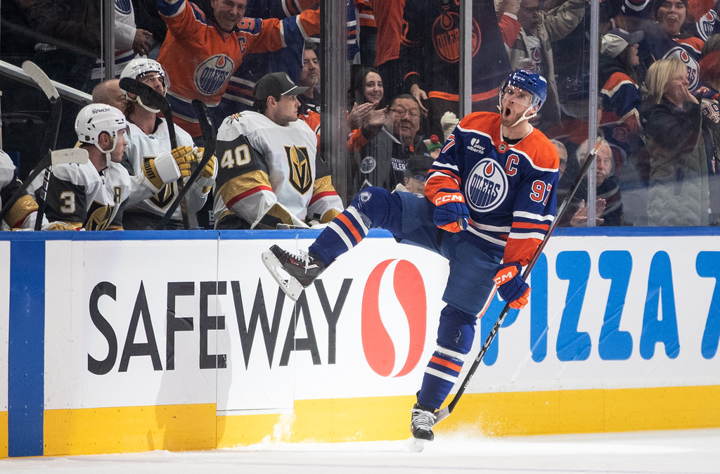 Edmonton Oilers' Connor McDavid (97) celebrates after a goal against the Vegas Golden Knights during first-period NHL hockey game action in Edmonton, Alberta, Sunday, Dec. 21, 2025. (Jason Franson/The Canadian Press via AP)