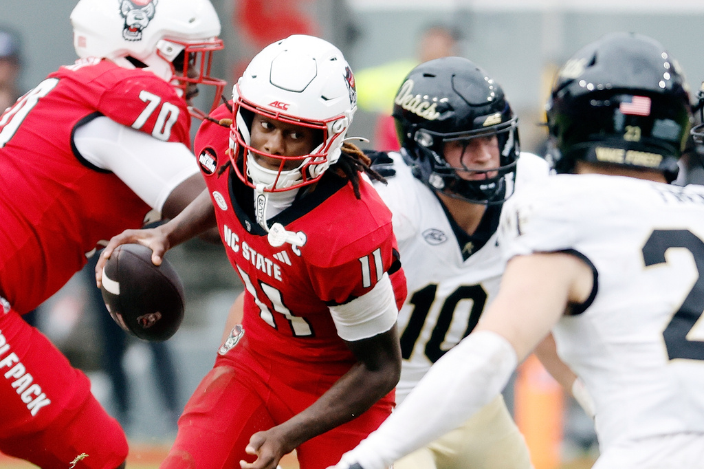 North Carolina State's CJ Bailey (11) runs the ball against Wake Forest during the second half of an NCAA college football game in Raleigh, N.C., Saturday, Oct. 10, 2026. (AP Photo/Karl DeBlaker)