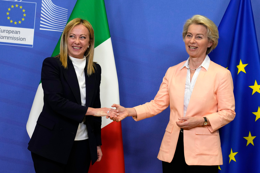 FILE - European Commission President Ursula von der Leyen, right, greets Italian Prime Minister Giorgia Meloni at EU headquarters in Brussels, Thursday, Nov. 3, 2022. (AP Photo/Virginia Mayo, File)