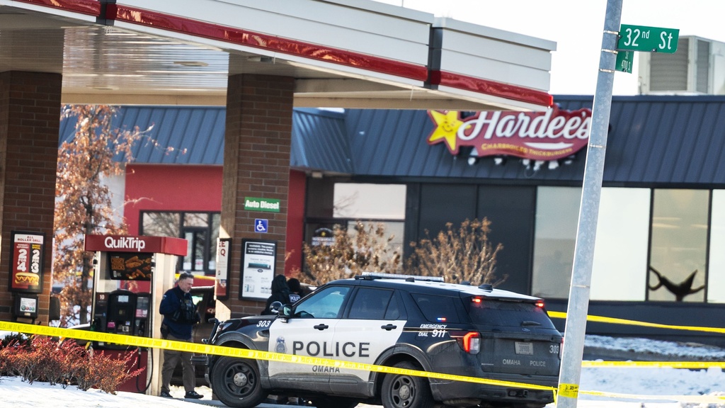 Omaha police investigate an incident at a QuikTrip gas station, that injured three officers and left the suspect dead in Omaha, Neb., Wednesday, Dec. 3, 2025. (Chris Machian/Omaha World-Herald via AP)