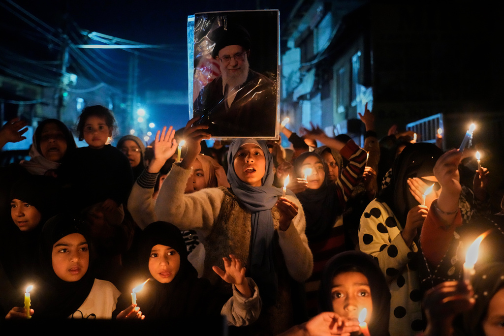 Shiite Muslims shout slogans during a candlelit protest against the killing of Iran's Supreme Leader Ayatollah Ali Khamenei, in Srinagar, Indian controlled Kashmir, Wednesday, March 4, 2026. (AP Photo/Mukhtar Khan)