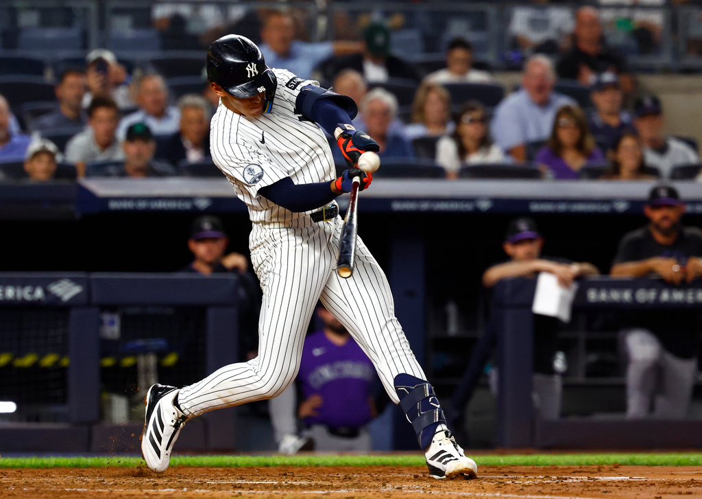 New York Yankees' George Lombard Jr. hits a grand slam against the Colorado Rockies during the third inning of a baseball game, Wednesday, Sept. 9, 2026, in New York. (AP Photo/Noah K. Murray)
