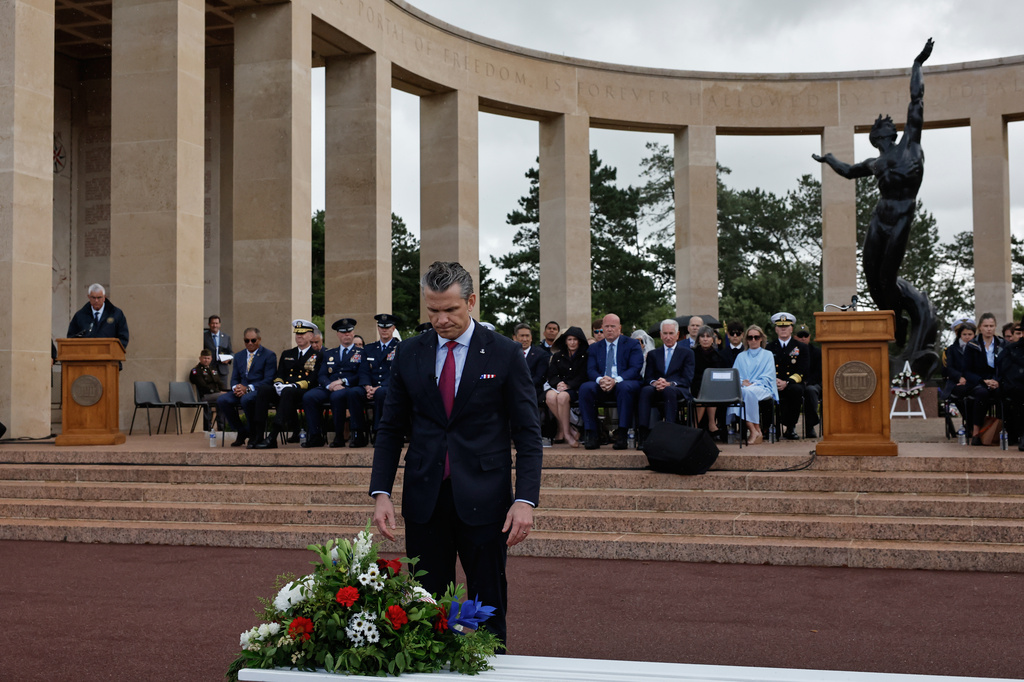 U.S. Defense Secretary Pete Hegseth lays a wreath of flowers during a ceremony at the US cemetery to commemorate the 82nd anniversary of the D-Day landings, in Colleville-sur-Mer, Normandy, France, Saturday, June 6, 2026. (AP Photo/Jeremias Gonzalez)