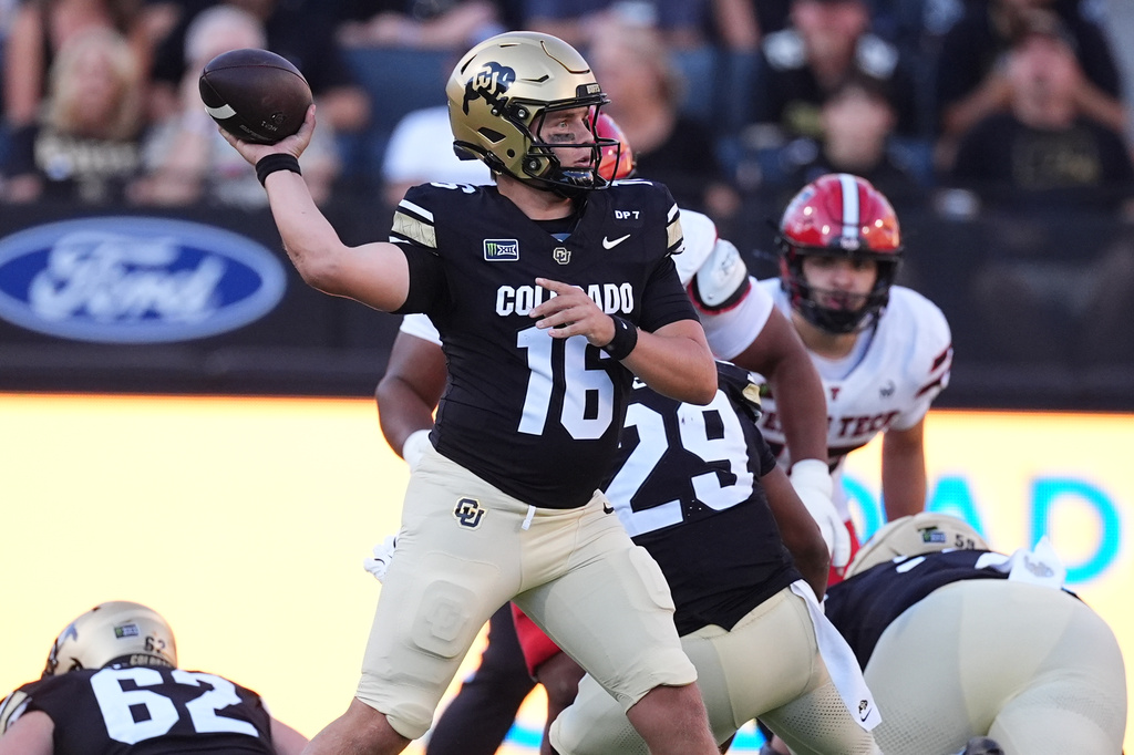 Colorado quarterback Isaac Wilson looks to throw a pass in the first half of an NCAA college football game against Texas Tech, Saturday, Oct. 3 2026, in Boulder, Colo. (AP Photo/David Zalubowski)