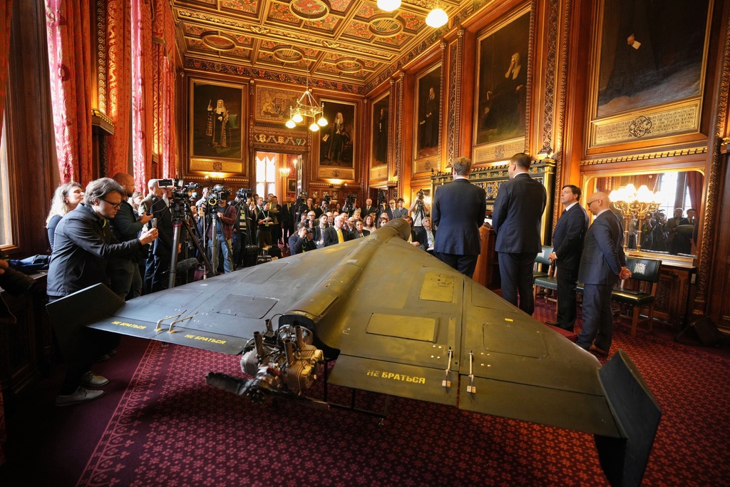 An Iranian Shahed-136 attack drone, acquired from Ukraine by United Against Nuclear Iran (UANI), is displayed at a press conference in Parliament in London, Tuesday, Oct. 14, 2025. (AP Photo/Kin Cheung)