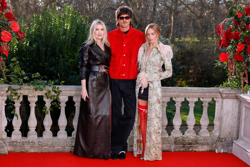 Director Emerald Fennell, from left, Jacob Elordi and Margot Robbie pose for photographers at the photo call for the film "Wuthering Heights" in London, Wednesday, Feb. 4, 2026. (Photo by Millie Turner/Invision/AP)