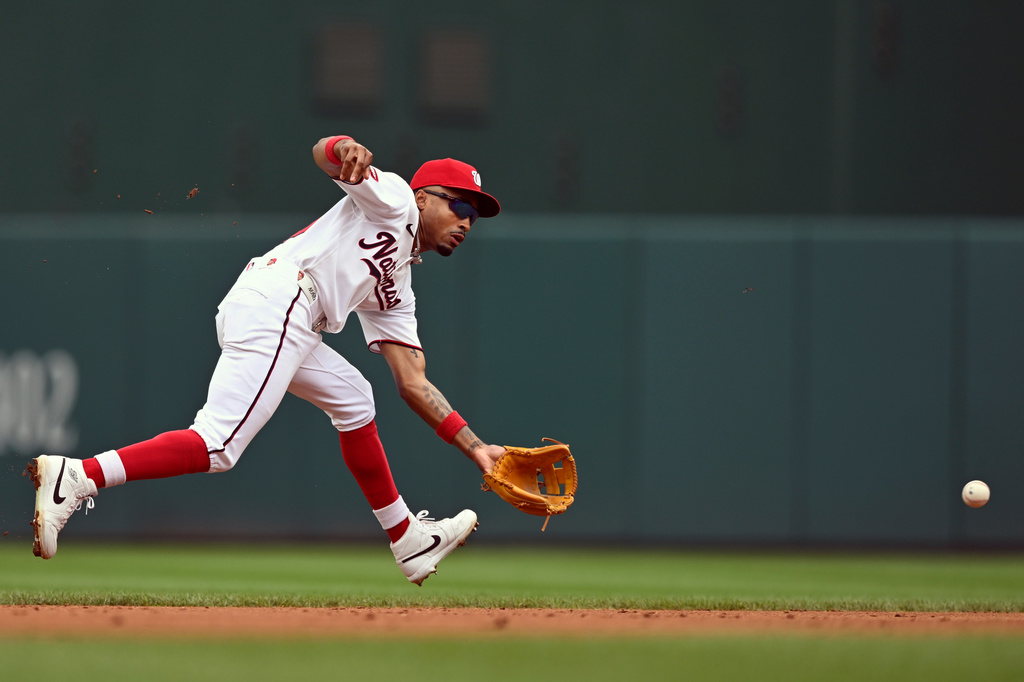 Washington Nationals short stop Nasim Nuñez fields a ground ball before throwing out Toronto Blue Jays' Ernie Clement during the second inning of a baseball game, Wednesday, July 29, 2026, in Washington. (AP Photo/John McDonnell)