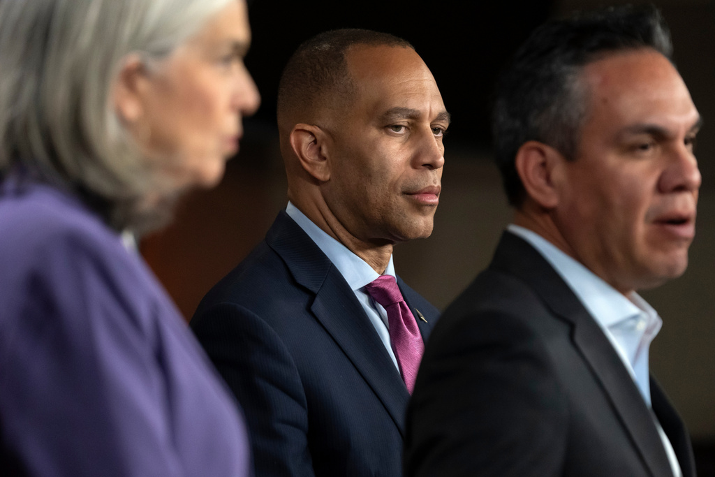 House Minority Leader Hakeem Jeffries, of N.Y., listens as House Democratic Caucus Chairman Rep. Pete Aguilar, D-Calif., right, speaks during a press conference on Capitol Hill on Wednesday, Oct. 1, 2025, in Washington. (AP Photo/Mark Schiefelbein)
