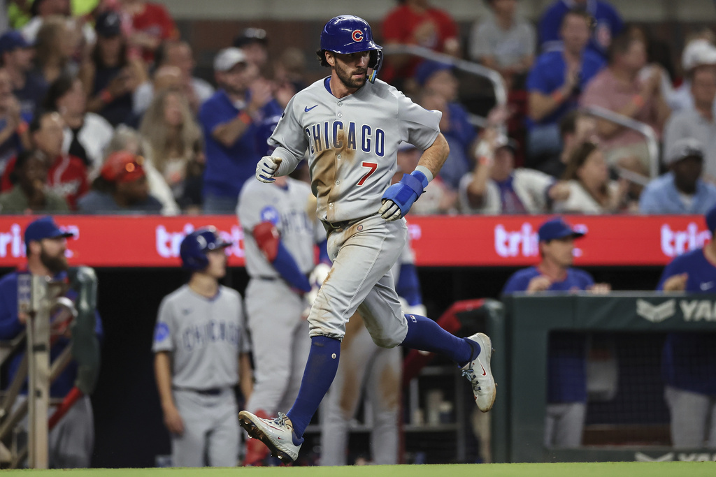 Chicago Cubs' Dansby Swanson (7) runs home during the fourth inning of a baseball game against the Atlanta Braves, Wednesday, Sept. 10, 2025, in Atlanta. (AP Photo/Colin Hubbard)