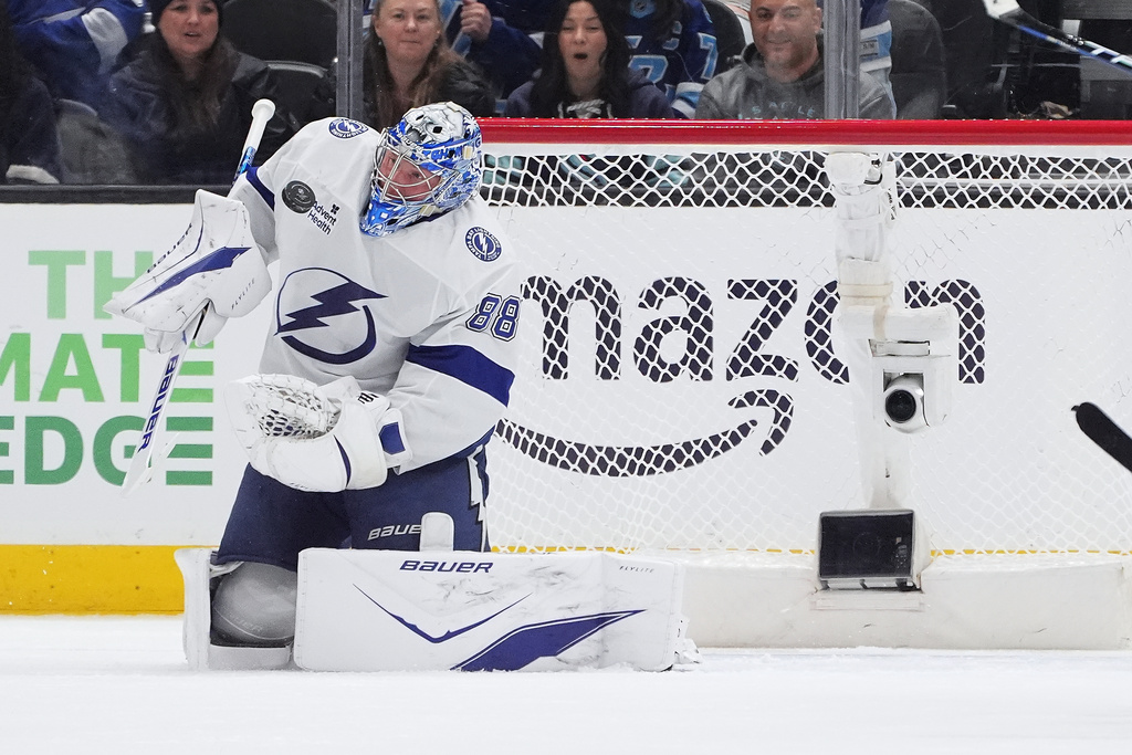 Tampa Bay Lightning goaltender Andrei Vasilevskiy (88) makes a save against the Seattle Kraken during the second period of an NHL hockey game Tuesday, March 17, 2026, in Seattle. (AP Photo/Lindsey Wasson)