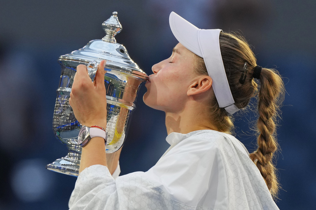 Elena Rybakina, of Kazakhstan, kisses the trophy after she won the women's singles final of the U.S. Open tennis championships against Aryna Sabalenka, of Belarus, Saturday, Sept. 12, 2026, in New York. (AP Photo/Kirsty Wigglesworth)