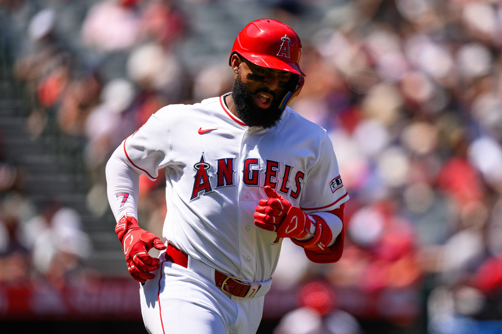 Los Angeles Angels designated hitter Jo Adell reacts after hitting a single during the second inning of a baseball game against the Atlanta Braves, Wednesday, April 8, 2026, in Anaheim, Calif. (AP Photo/William Liang)