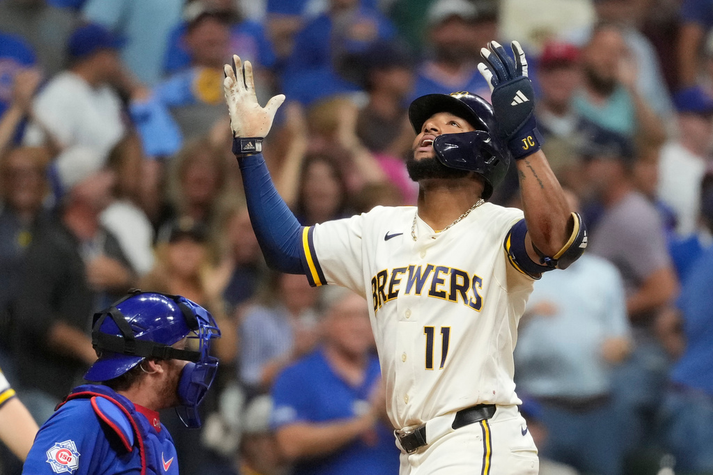 Milwaukee Brewers' Jackson Chourio gestures as he rounds the bases after hitting a two-run home during the ninth inning of a baseball game against the Chicago Cubs, Tuesday, Sept. 8, 2026, in Milwaukee. (AP Photo/Aaron Gash)