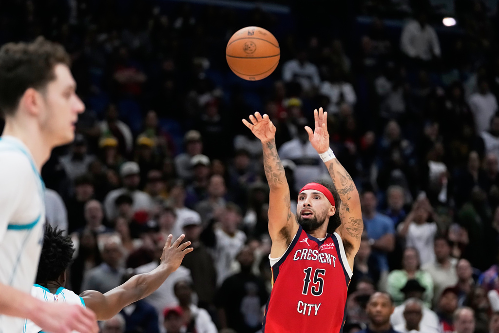 New Orleans Pelicans guard Jose Alvarado (15) shoots the go-ahead 3-point basket in the final minute of the second half in their win over the Charlotte Hornets during an NBA basketball game, Tuesday, Nov. 4, 2025, in New Orleans. (AP Photo/Gerald Herbert)