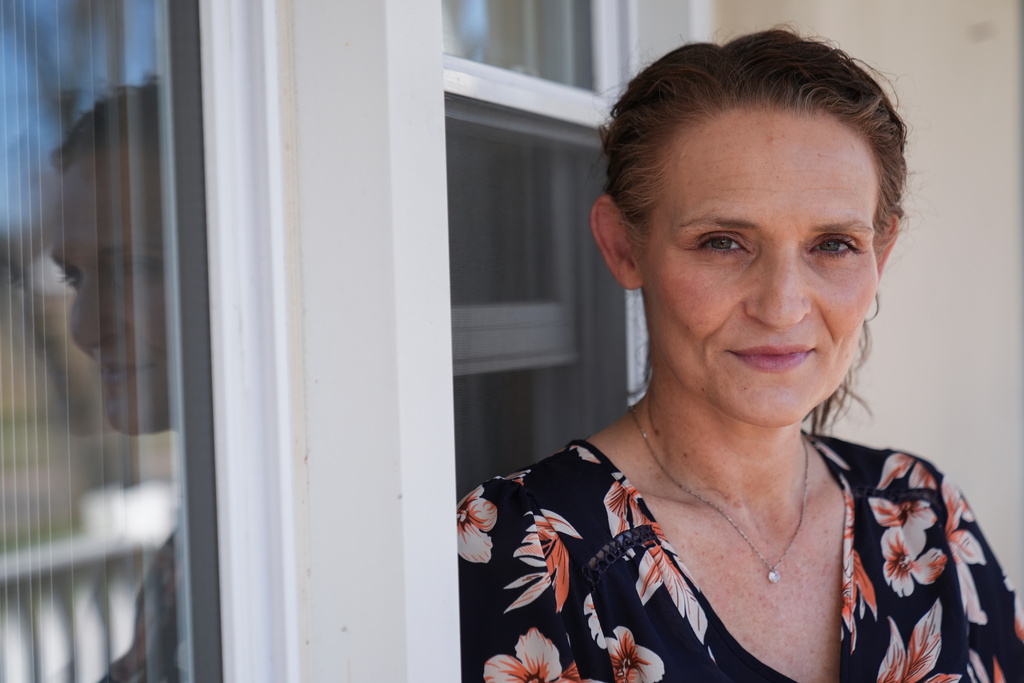 Jessica Thompson, 47, sits for a portrait at her Rockford, Ill., home on Saturday, March 21, 2026. (AP Photo/Erin Hooley)