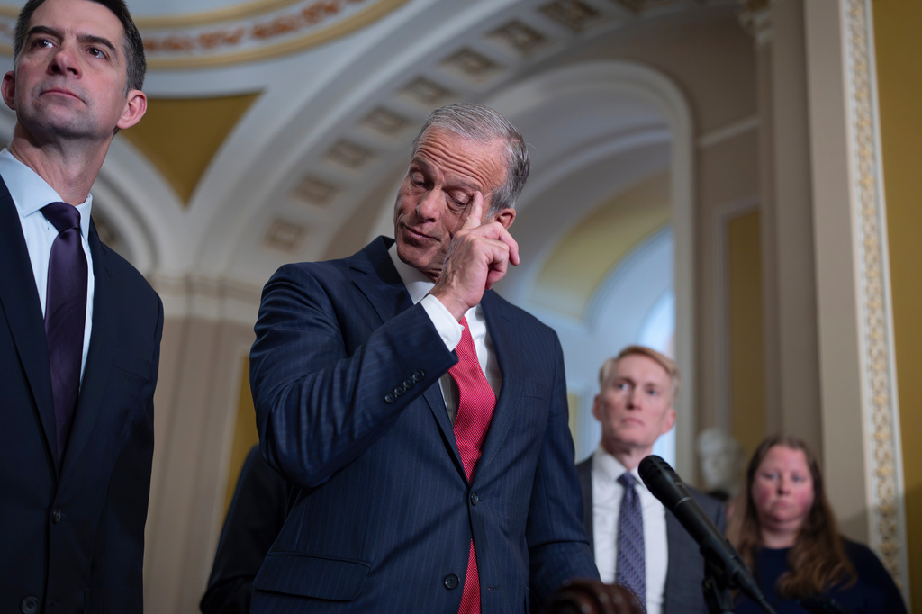 Senate Majority Leader John Thune, R-S.D., flanked by Sen. Tom Cotton, R-Ark., left, and Sen. John Barrasso, R-Wyo., speaks to reporters following a closed-door party meeting, at the Capitol in Washington, Tuesday, April 21, 2026. (AP Photo/J. Scott Applewhite)