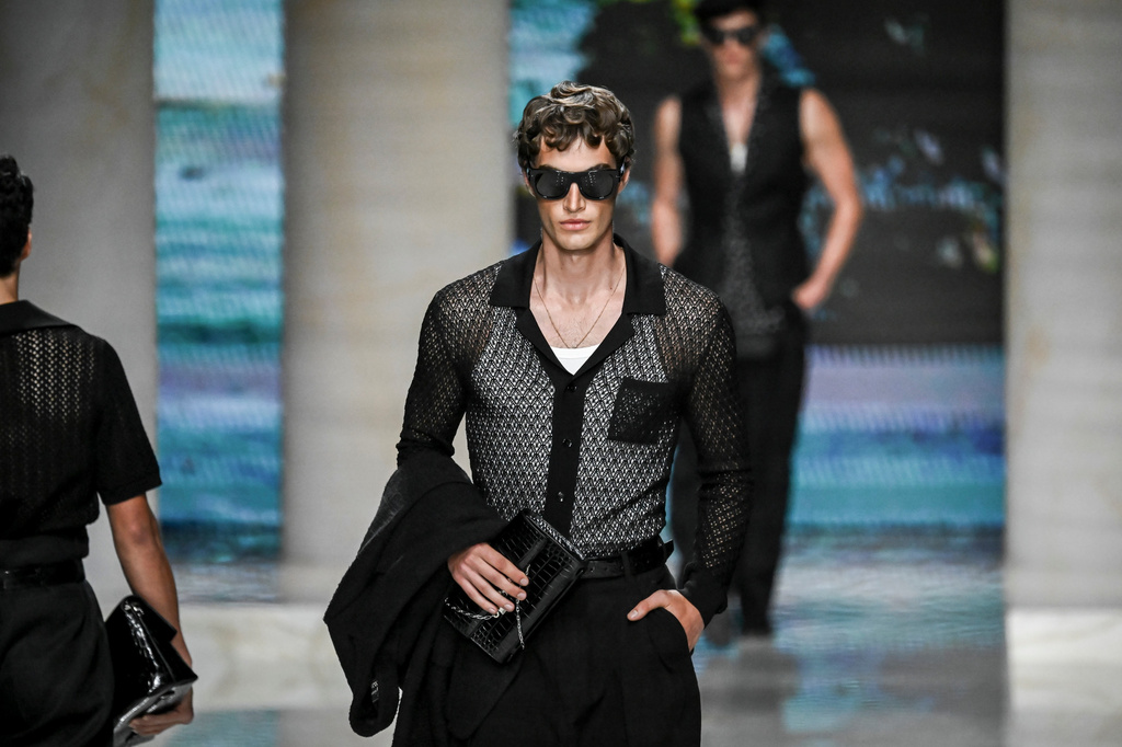 A model wears a creation from the Dolce & Gabbana Spring/Summer 2027 Men's collection presented in Milan, Italy, Saturday, June 20, 2026. (AP Photo/Nicola Marfisi)