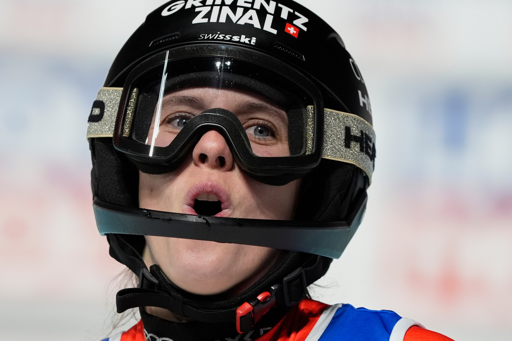 Switzerland's Camille Rast celebrates at the finish area of an alpine ski, women's World Cup slalom, in Courchevel, France, Tuesday, Dec. 16, 2025. (AP Photo/Giovanni Auletta)
