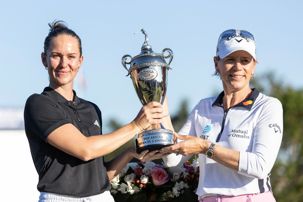Linn Grant, left, and Annika Sorenstam, right, hold the championship trophy after Grant's win on the final day of The Annika LPGA golf tournament in Belleair, Fla., Sunday, Nov. 16, 2025. (AP Photo/Willie J. Allen Jr.)