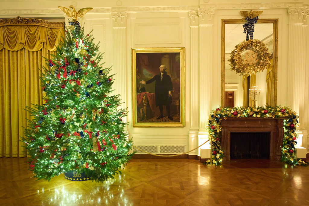 Christmas trees decorate the East Room of the White House during a press preview of the Christmas decorations "Home is Where the Heart Is," Monday, Dec. 1, 2025, in Washington. (AP Photo/Evan Vucci)