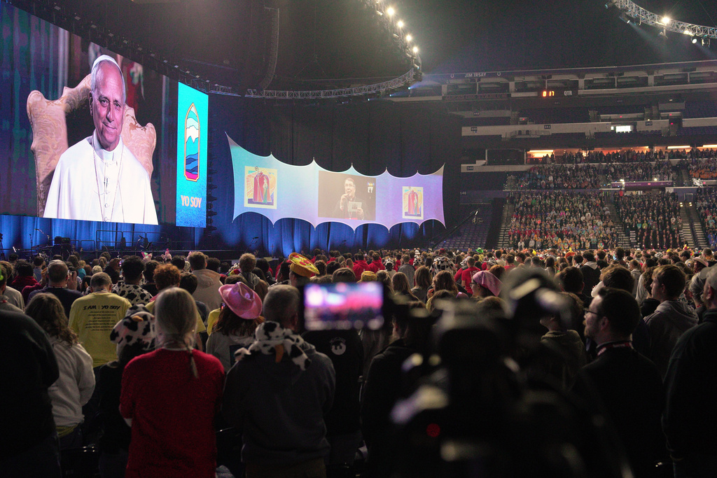 Pope Leo XIV speaks remotely from the Vatican to thousands of Catholics at the National Catholic Youth Conference on Friday, Nov. 21, 2025, in Indianapolis. (AP Photo/Obed Lamy)