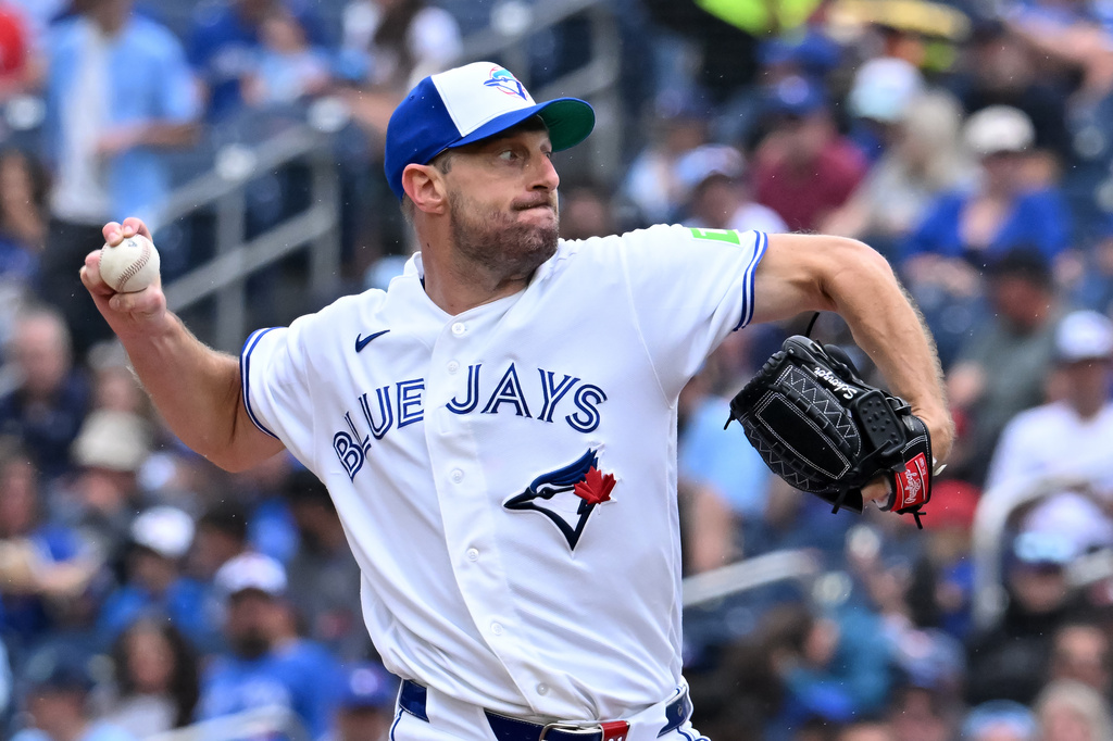 Toronto Blue Jays pitcher Max Scherzer throws to a Seattle Mariners batter during the first inning of a baseball game in Toronto, Sunday, Aug. 30, 2026. (Jon Blacker/The Canadian Press via AP)
